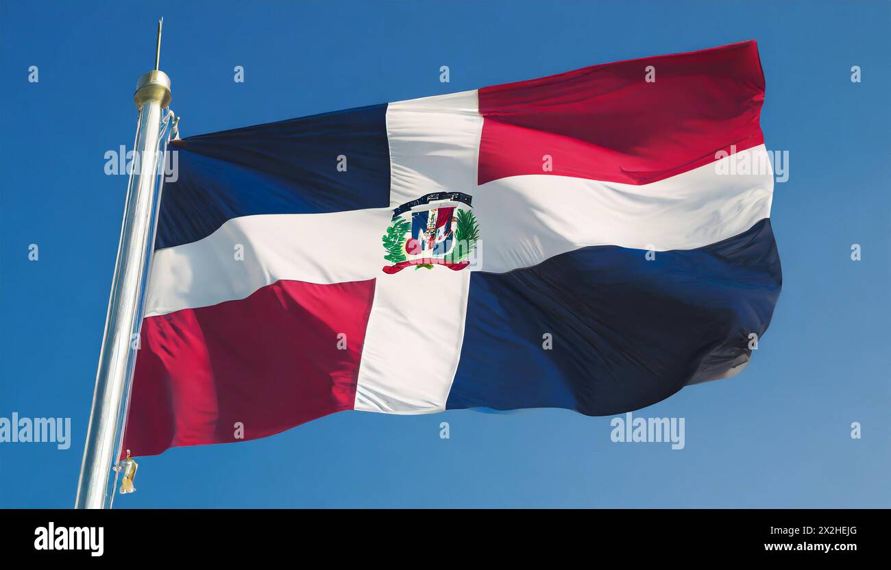 Die Fahne von Dominikanische Republik flattert im Wind, isoliert gegen blauer Himmel Banque D'Images