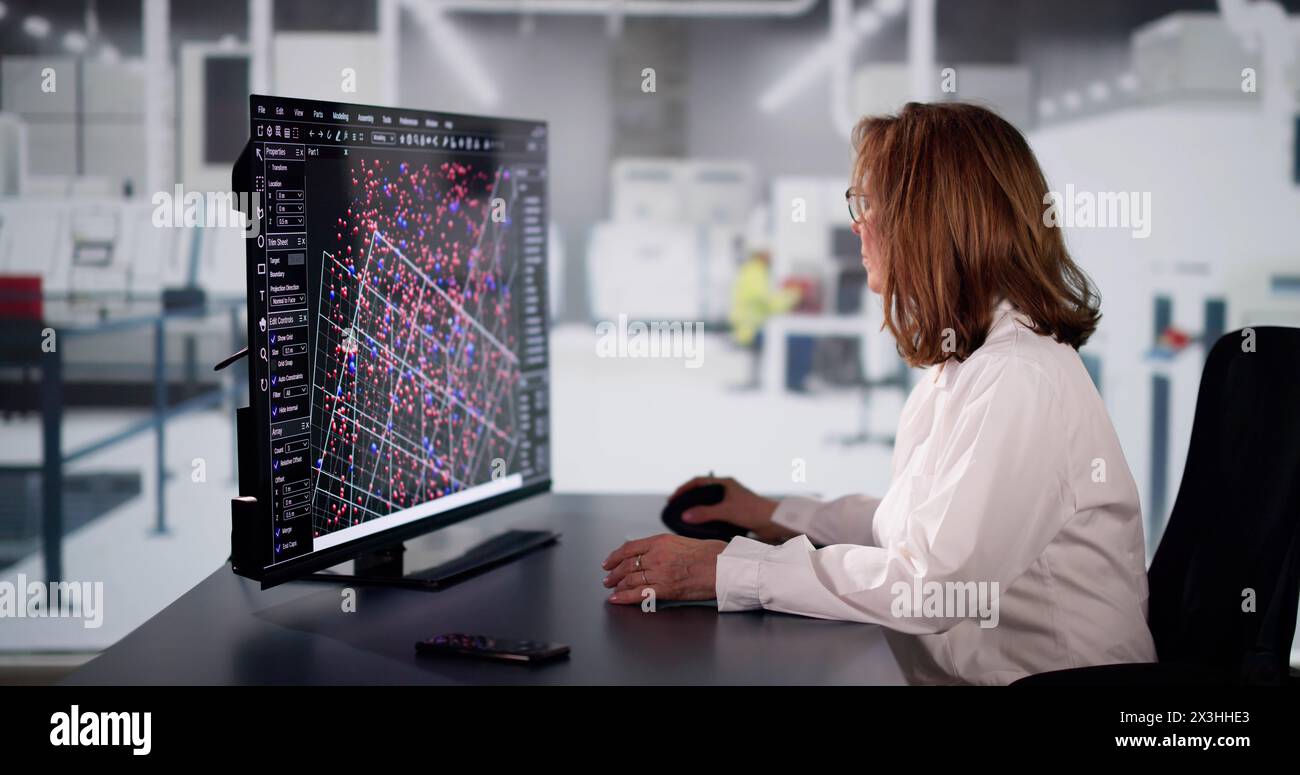 Ingénieurs opérateurs utilisant le système SCADA dans une usine industrielle Banque D'Images