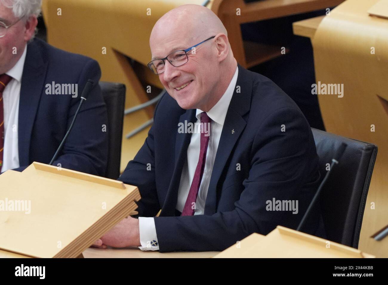 John Swinney au Parlement écossais à Édimbourg. Le SNP commence la recherche d'un nouveau dirigeant après une journée de drame dans la politique écossaise a vu Humza Yousaf annoncer sa démission de son poste de premier ministre du pays. Date de la photo : mardi 30 avril 2024. Banque D'Images
