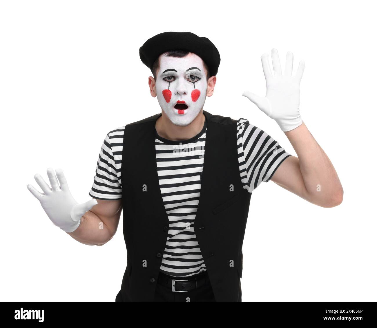 MIME artiste faisant visage choqué sur fond blanc Banque D'Images
