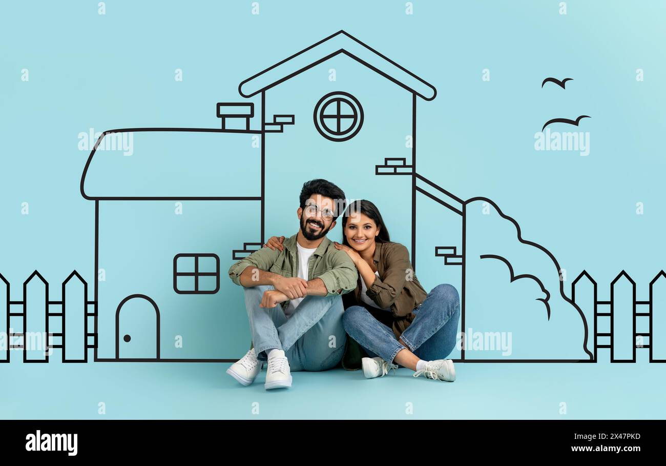 Homme indien et femme assis devant le dessin Banque D'Images