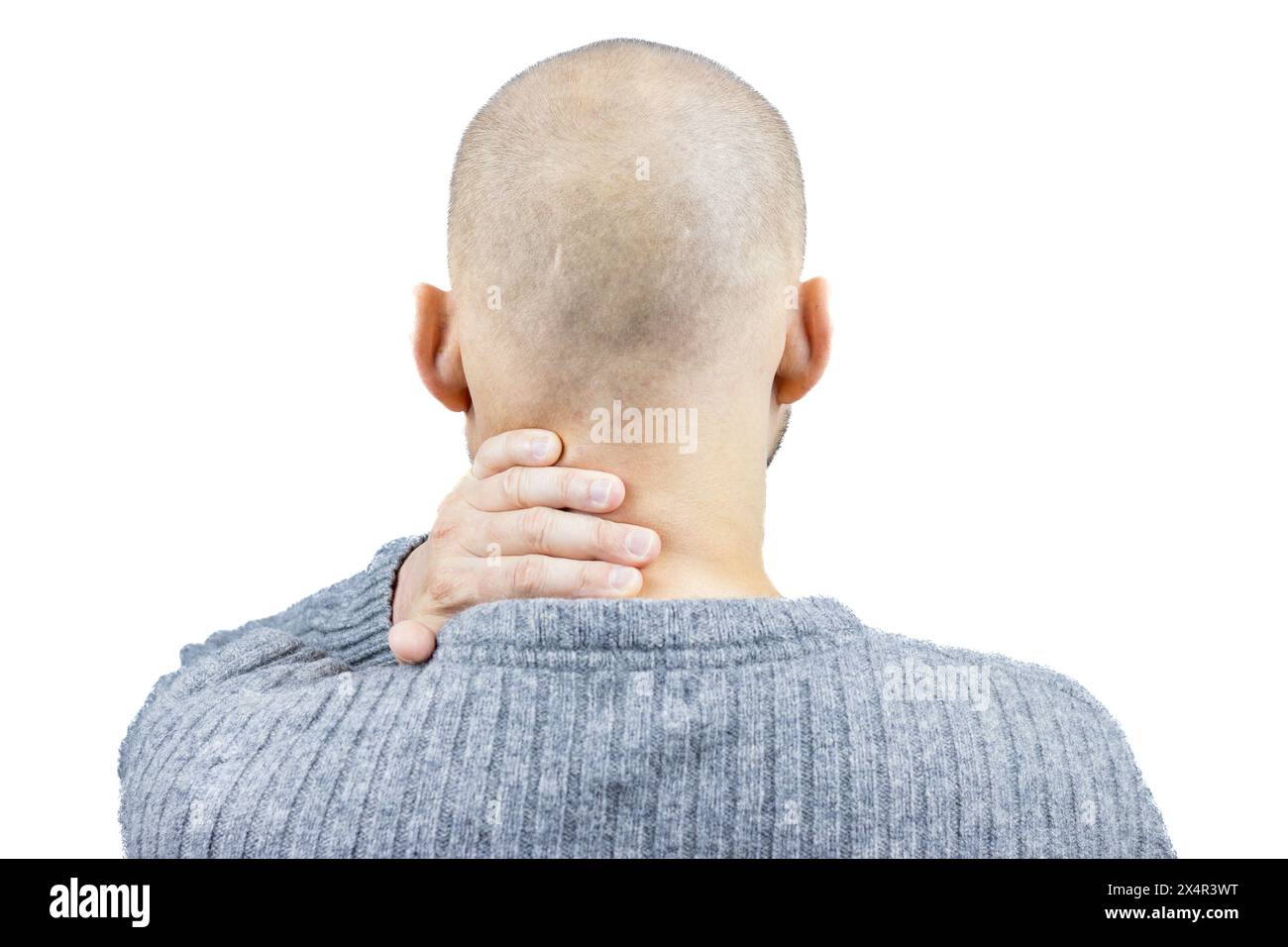 C’est un portrait puissant d’un homme, vu de derrière sur fond blanc, sa main saisissant son cou dans un geste qui en dit long sur t Banque D'Images