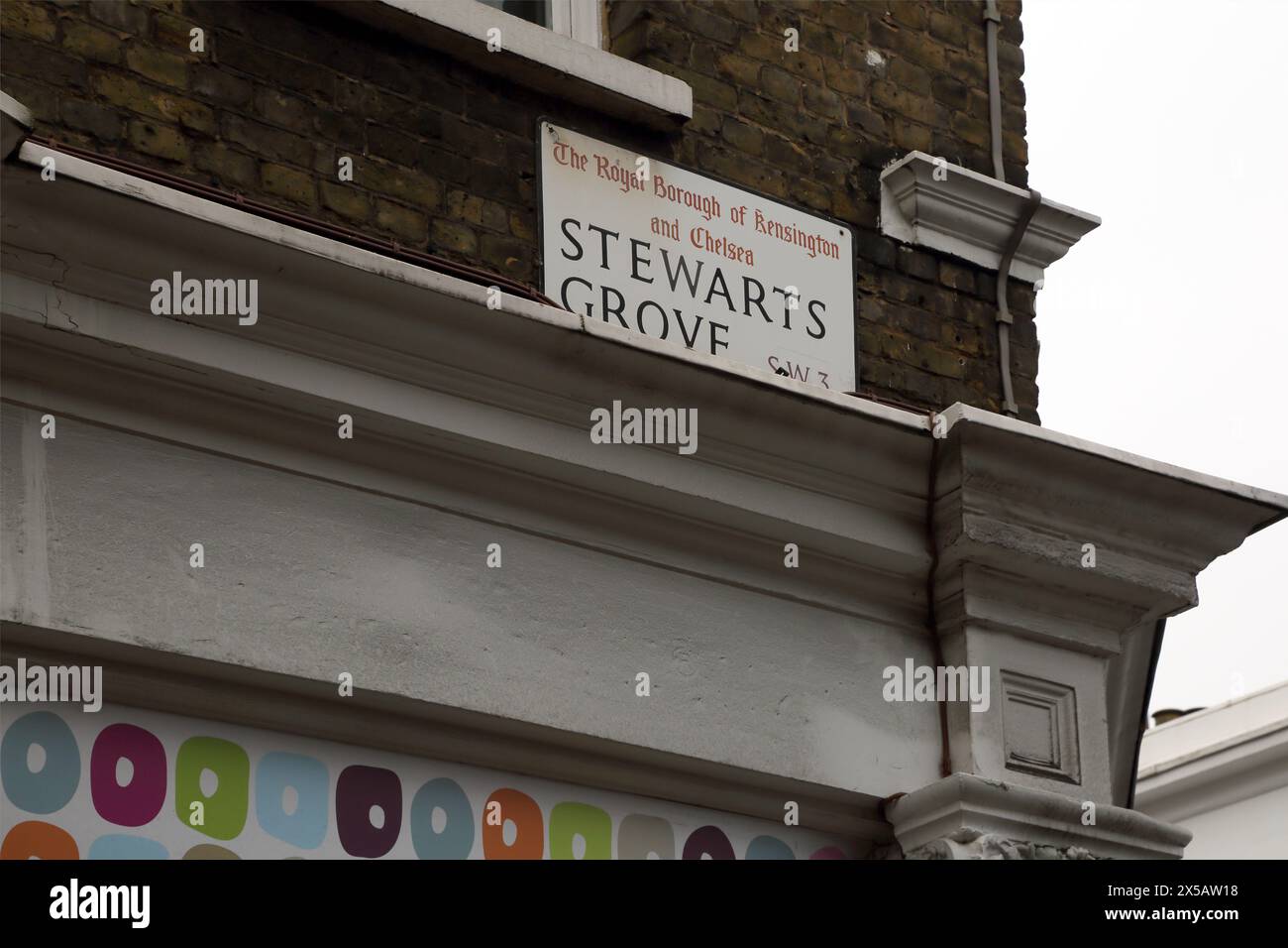 Maisons mitoyennes colorées peintes Stewarts Grove Chelsea SW3 Londres Angleterre Banque D'Images
