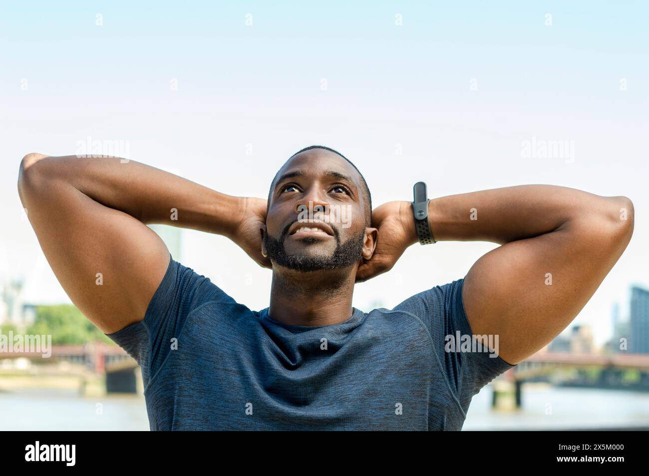 Mid adult man stretching Banque D'Images