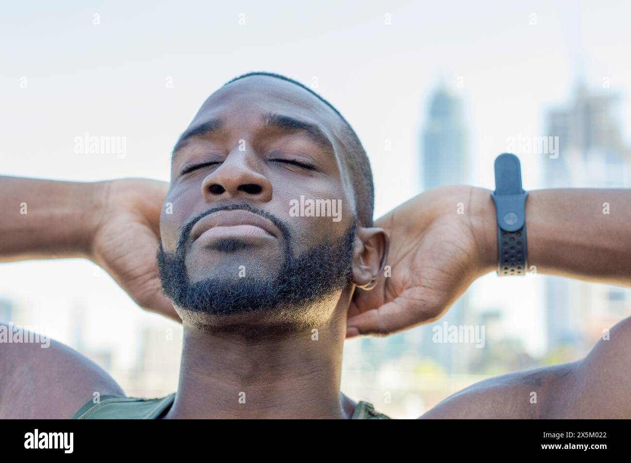 Mid adult man stretching Banque D'Images