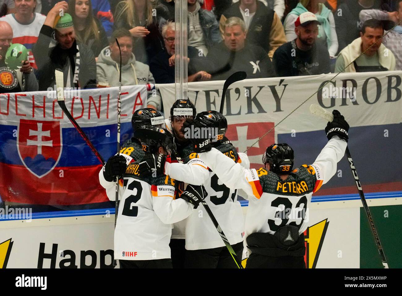 Germany's Dominik Kahun celebrates with teammates after scoring his side's third goal during the preliminary round match between Slovakia and Germany at the Ice Hockey World Championships in Ostrava, Czech Republic, Friday, May 10, 2024. (AP Photo/Darko Vojinovic) Banque D'Images