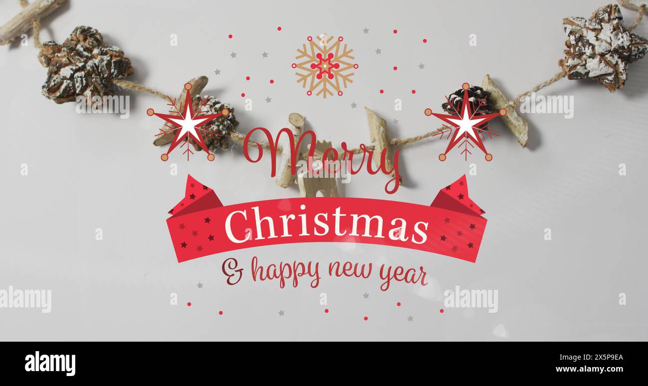 Les décorations des fêtes entourent le message Joyeux Noël et bonne année Banque D'Images