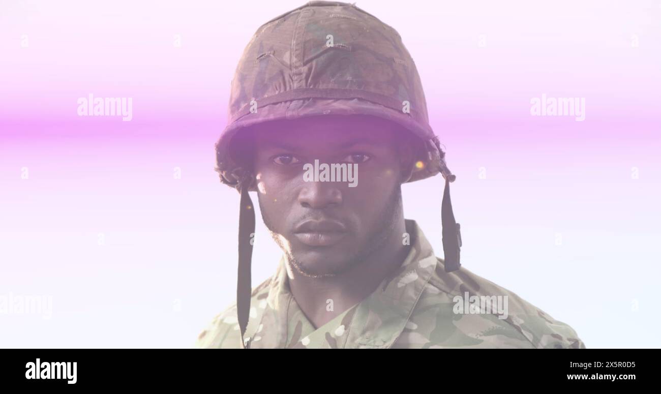 Chef afro-américain portant un équipement militaire de camouflage, l'air sérieux Banque D'Images