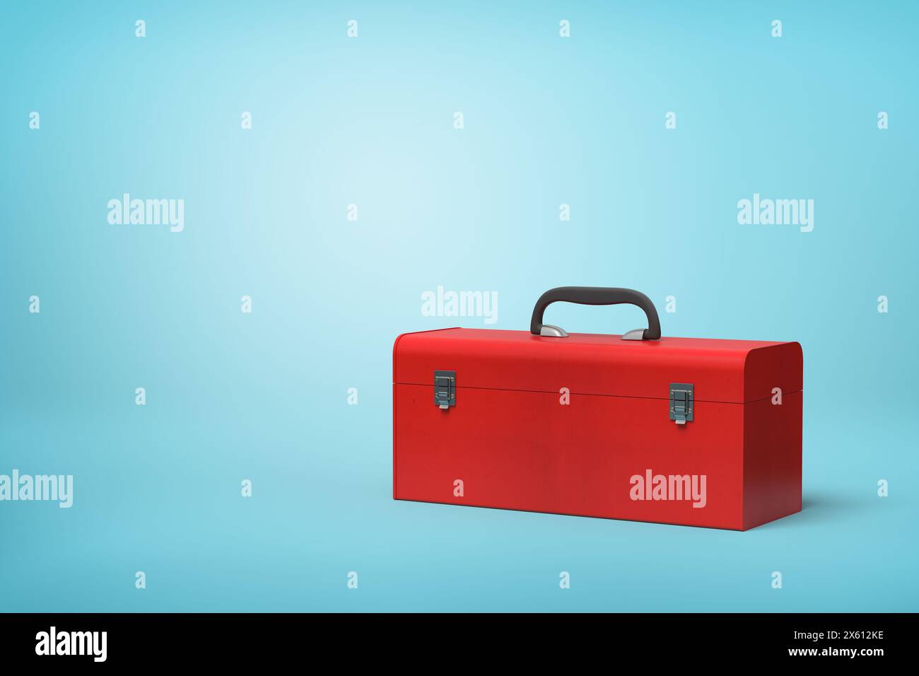 Boîte à outils fermée rouge vif sur fond bleu Banque D'Images