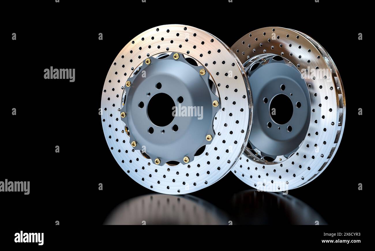 Paire de disques de frein percés ventilés voitures de sport isolé fond noir Banque D'Images