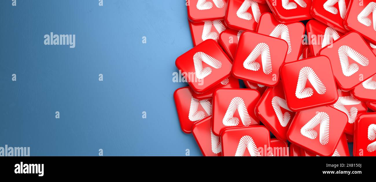 Logos du système de génération d'image générative ai Adobe Firefly sur un tas sur une table. Banque D'Images