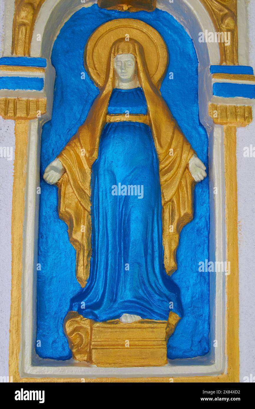 Une figure de Marie sur le mur de la maison Banque D'Images