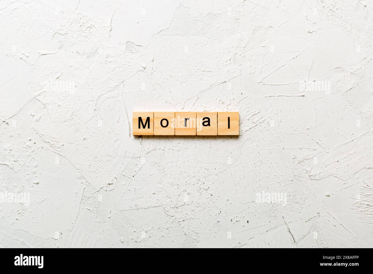 mot moral écrit sur bloc de bois. texte moral sur table, concept. Banque D'Images