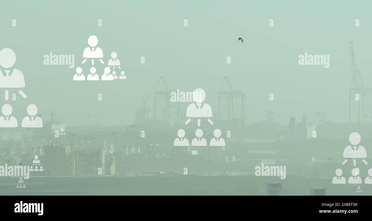 Image d'un réseau d'icônes de profil flottant contre une vue aérienne du paysage urbain Banque D'Images