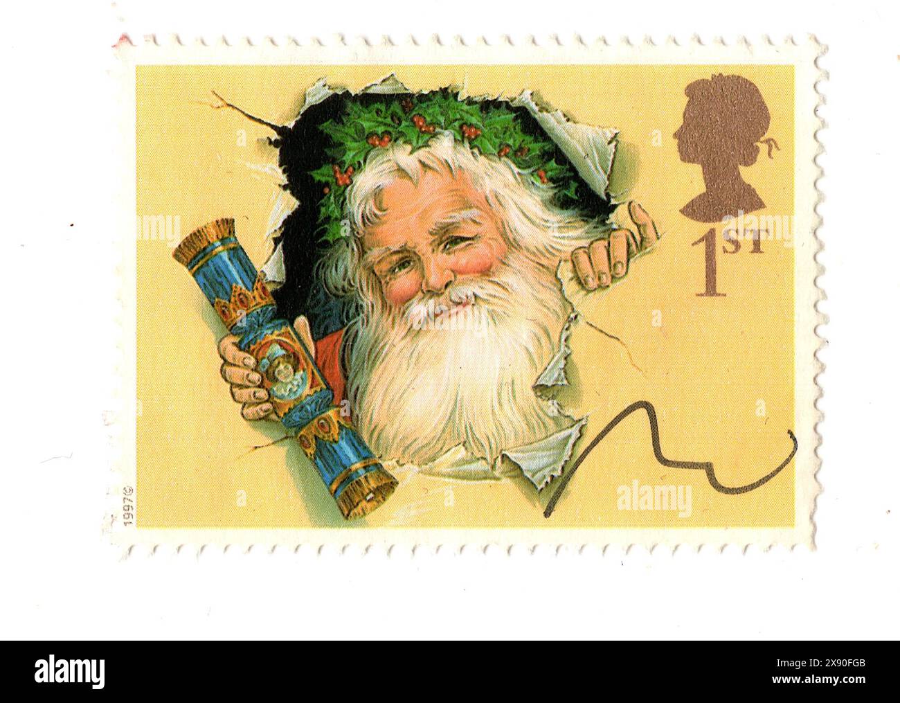 Un timbre-poste vintage de Noël du Royaume-Uni isolé sur un fond blanc. Banque D'Images