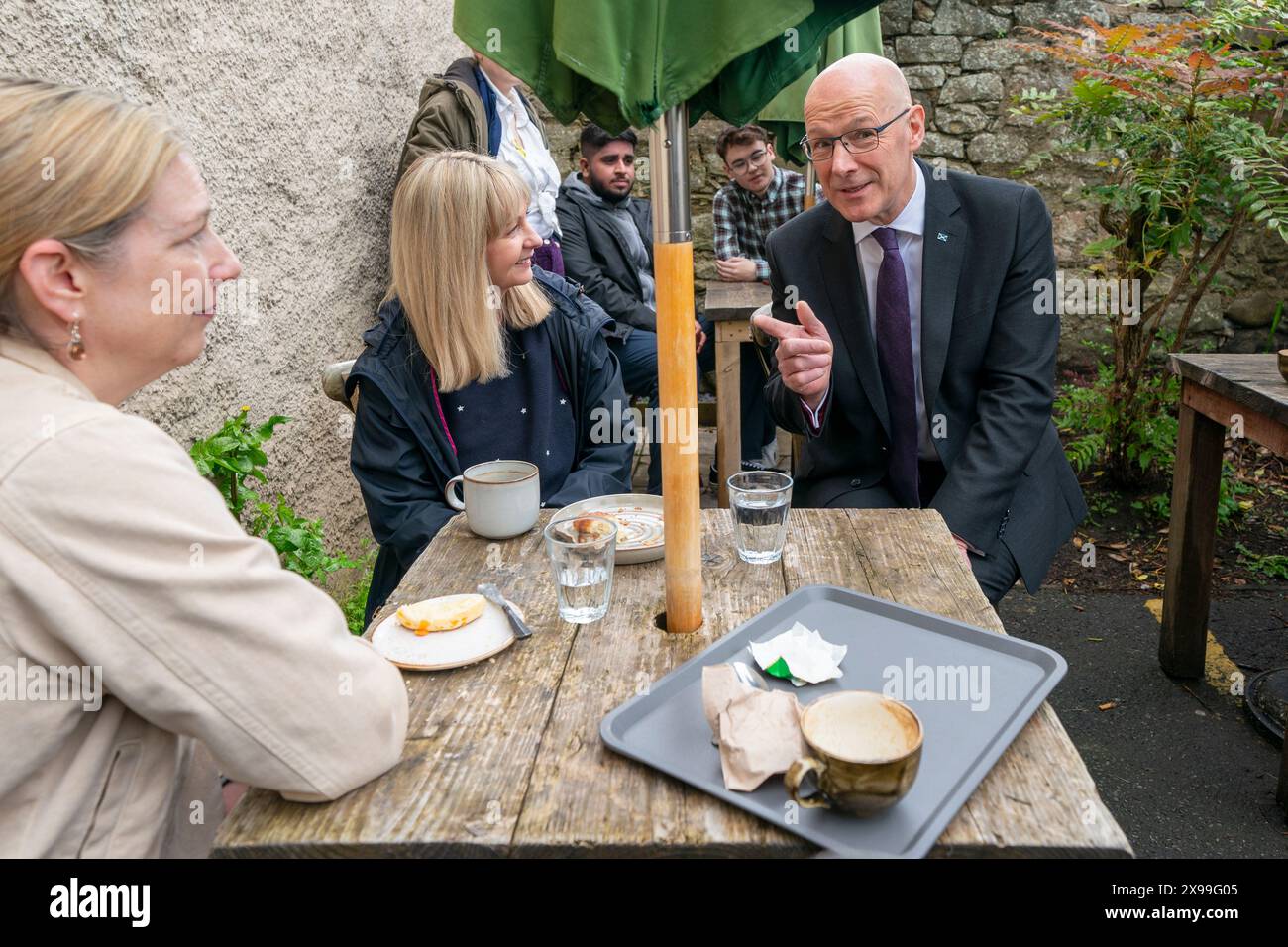 Le chef du Parti national écossais John Swinney lors d'une visite au Dower House Cafe à Édimbourg, alors qu'il était sur la piste de la campagne électorale générale. Date de la photo : jeudi 30 mai 2024. Banque D'Images