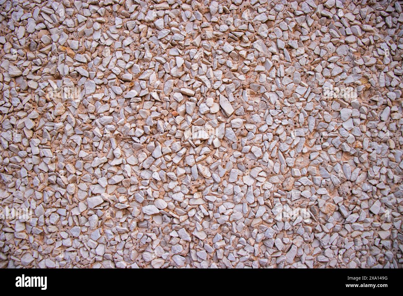 Photographie rapprochée d'un mur texturé à motifs sur la façade d'un bâtiment historique à El Papiol, en Espagne Banque D'Images