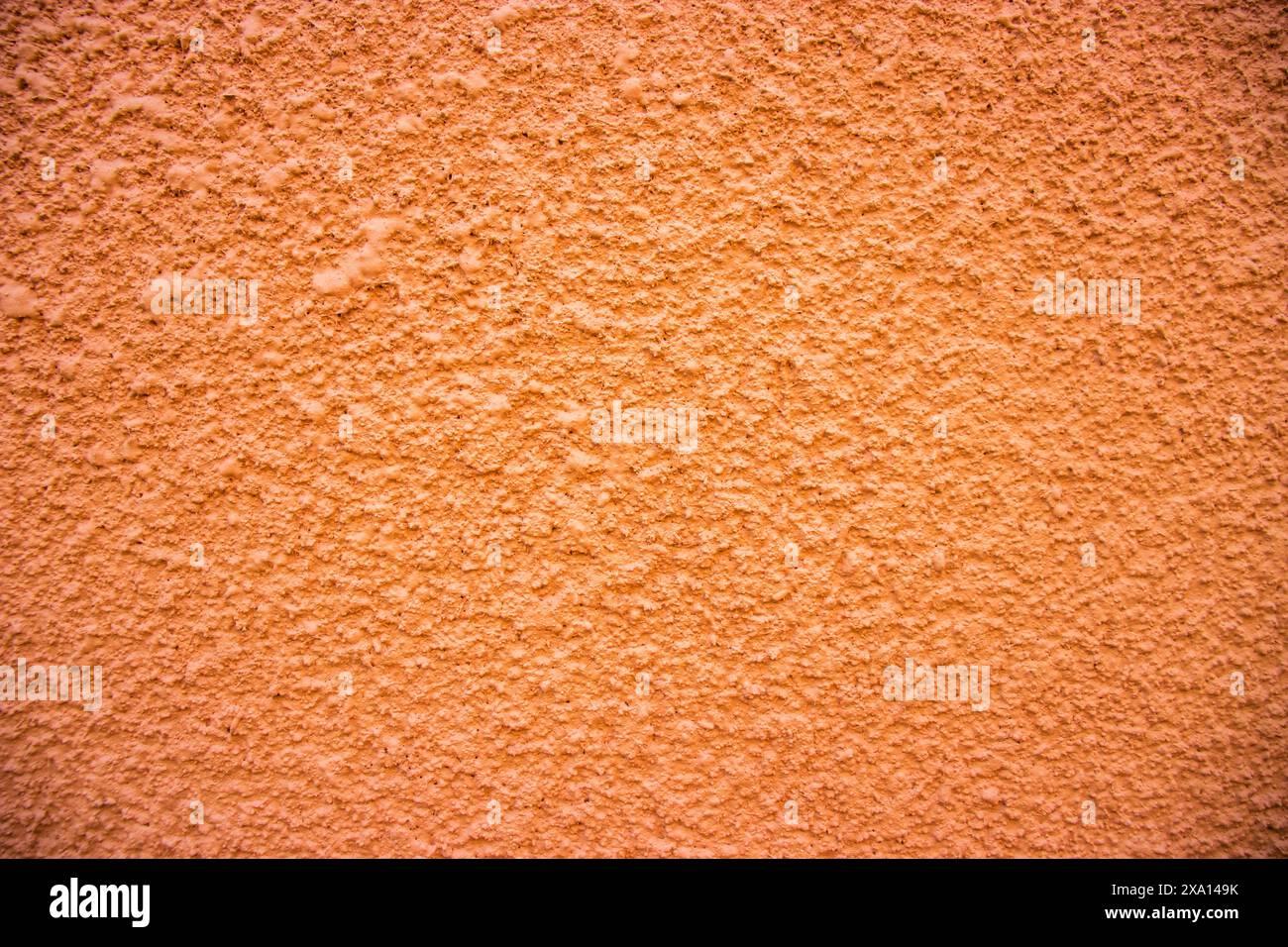 Photographie rapprochée d'un mur texturé à motifs sur la façade d'un bâtiment historique à El Papiol, en Espagne Banque D'Images