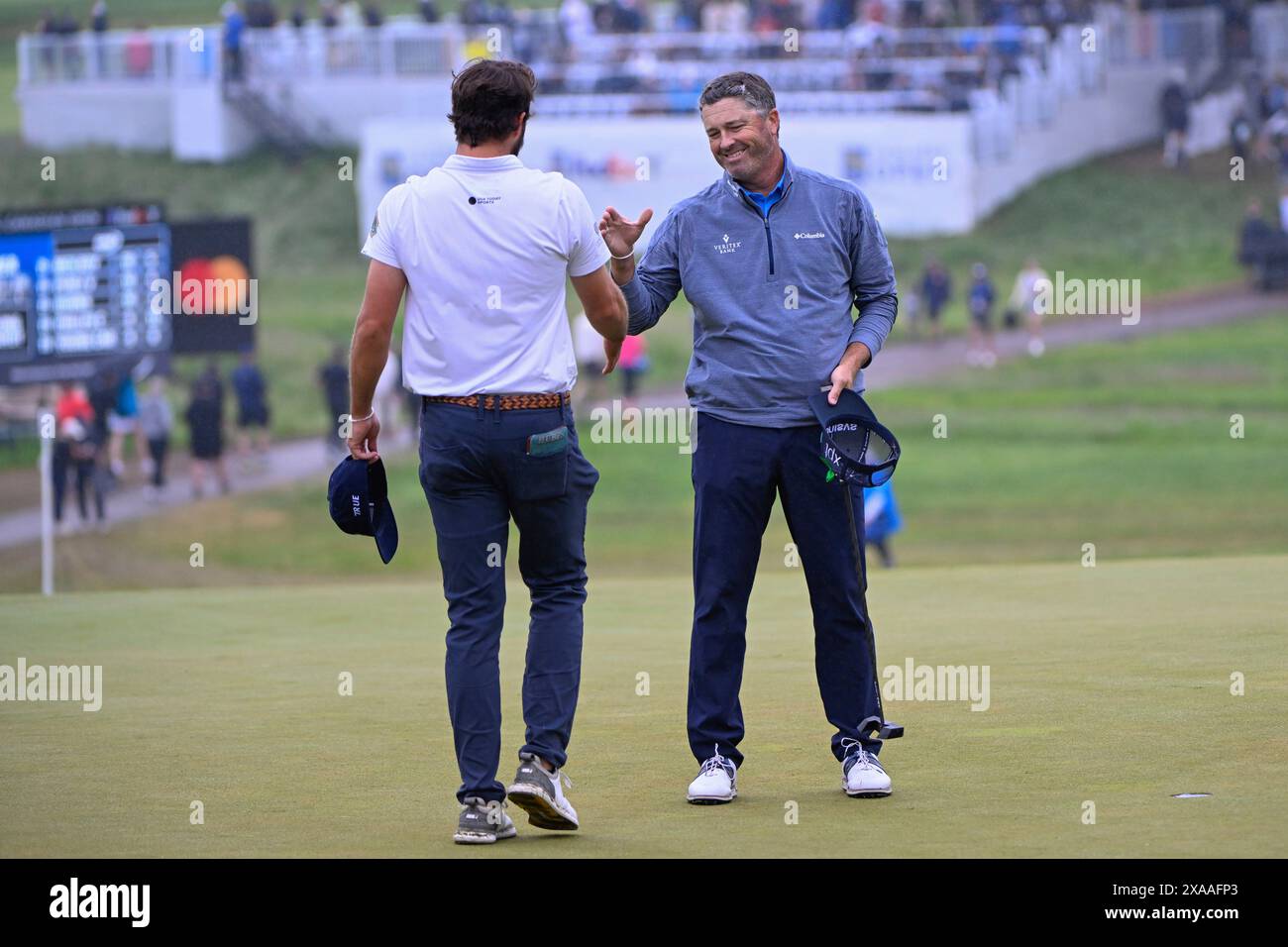 ANCASTER, ON - JUNE 02: Ryan Palmer (USA) shakes hands with playing partner Mark Hubbard (USA) on the green on 18 following the final round of the RBC Canadian Open on June 2, 2024 at Hamilton Golf & Country Club in Ancaster, Ontario, Canada. (Photo by Ken Murray/Icon Sportswire) (Icon Sportswire via AP Images) Banque D'Images