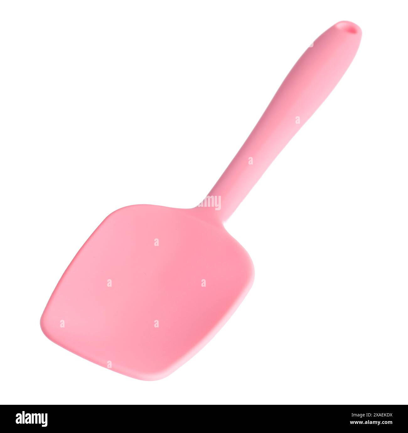Une spatule rose isolée sur blanc. Ustensile de cuisine Banque D'Images