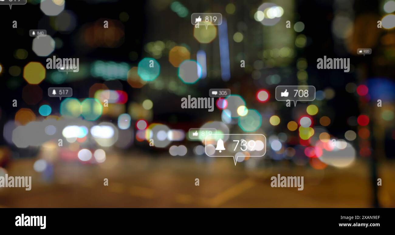 Image des icônes des médias sociaux contre la vue floue de la circulation nocturne en ville Banque D'Images