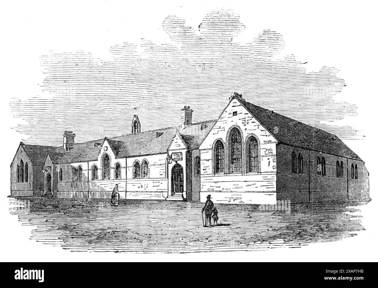 Tyne Docks British Schools, [South Shields, Tyneside], 1869. École construite '...sur un terrain donné par la compagnie de chemin de fer, attenant à la gare de Tyne Dock. M. Prosser, architecte de la North Eastern Railway Company, a préparé les plans pour les écoles nationales et britanniques: les deux bâtiments se ressemblent... la conception est de caractère médiéval, librement traitée, sans prétention à des détails élaborés et ornementaux, le but principal de l'architecte étant de répondre aux exigences des écoles - bon agencement, bien éclairé et ventilé. Le bâtiment... est de briques rouges, soulagé par l'introduction o Banque D'Images