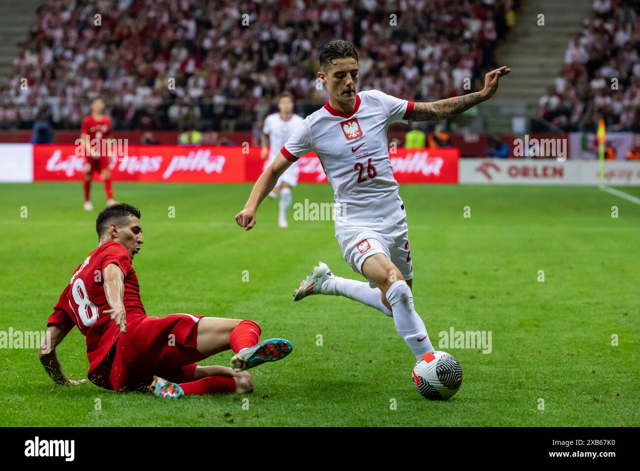 Varsovie, province de Mazovie, Pologne. 10 juin 2024. Mert Muldur (à gauche), Kacper Urbanski (à droite) lors du match international amical de football entre la Pologne et la Turquie au stade national de Varsovie. Crédit : ZUMA Press, Inc/Alamy Live News Banque D'Images