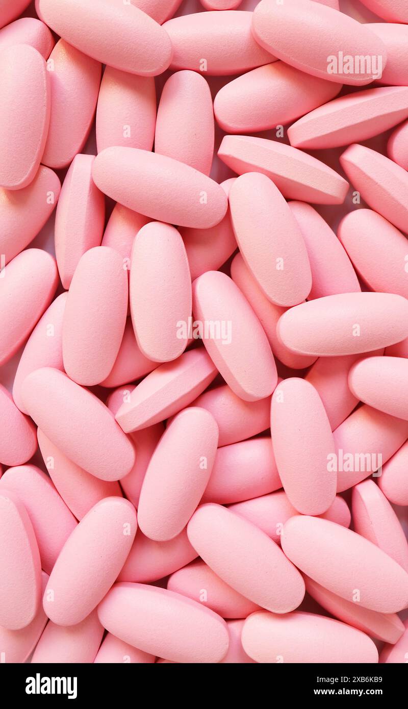Tas de pilules roses de forme ovale pour le concept de médical Banque D'Images
