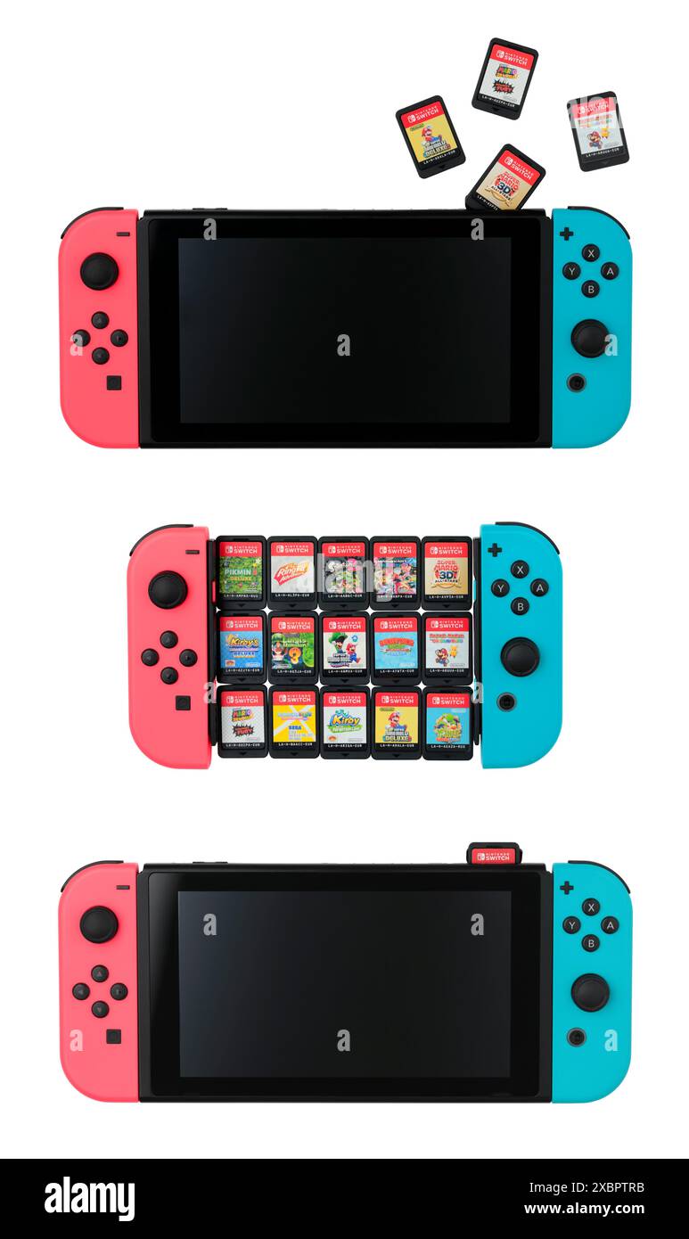 Ensemble de consoles de jeux Nintendo Switch avec les cartouches, isolé sur un fond blanc. La Nintendo Switch est la septième console de maison majeure Nintendo p Banque D'Images