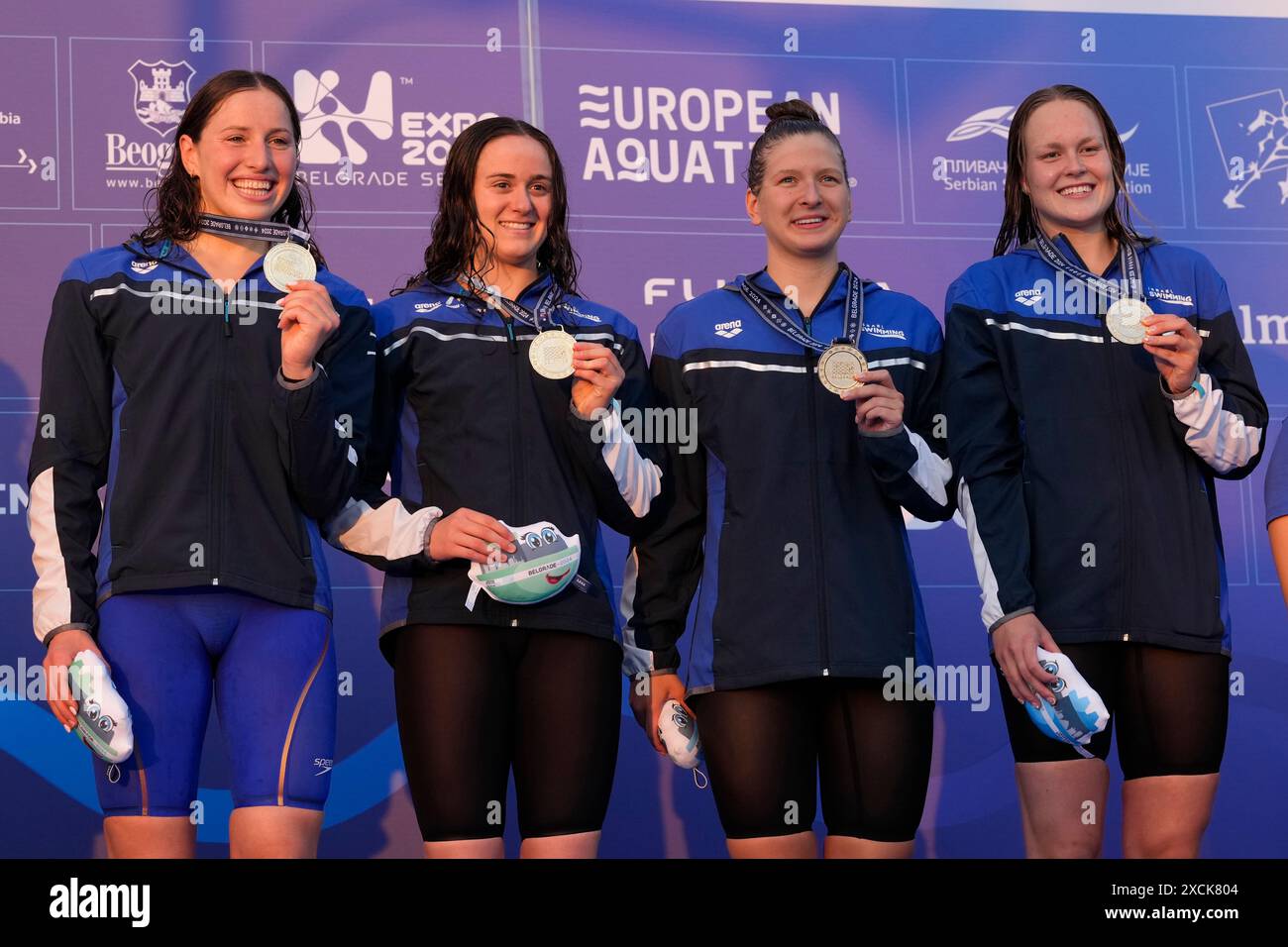Winners from left: Israel's Lea Polonsky, Ayla Riley Spitz, Daria Golovaty and Anastasia Gorbenko pose during a medal ceremony for the women's 4 x 200m freestyle relay at the European Aquatics Championships in Belgrade, Serbia, Monday, June 17, 2024. (AP Photo/Darko Bandic) Banque D'Images