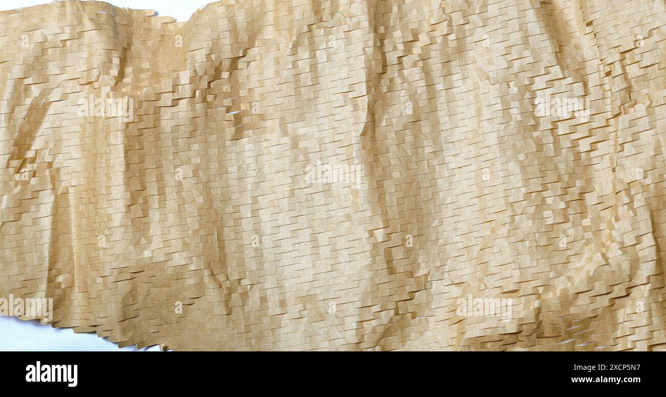 Texture rapprochée du papier d'emballage écologique, papier bulle léger pour emballage protecteur, papier nid d'abeille respectueux de l'environnement. Banque D'Images