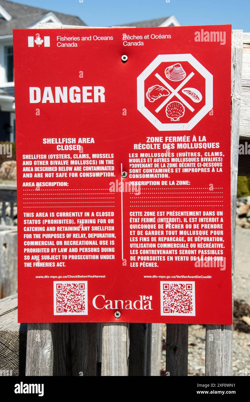 Danger Shellfish Area panneau fermé sur la plage par Pendlebury Lighthouse à qualifié Andrews, Nouveau-Brunswick, Canada Banque D'Images