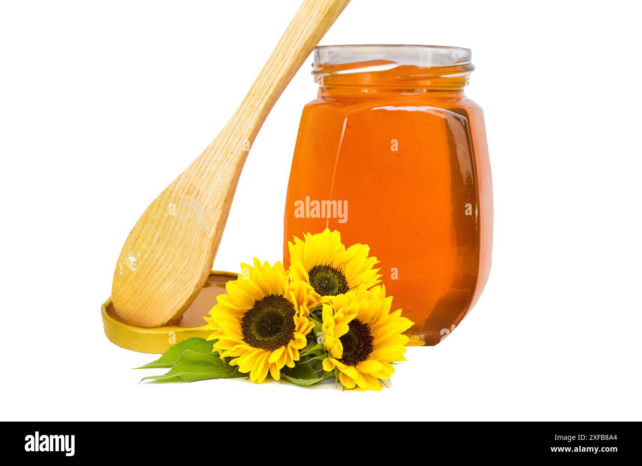 Pot de liquide, miel doux dans le peigne, pot en verre sur fond en bois, miel de fleur de pollen de nature dans une bouteille en verre, pot de miel avec du miel en bois Banque D'Images