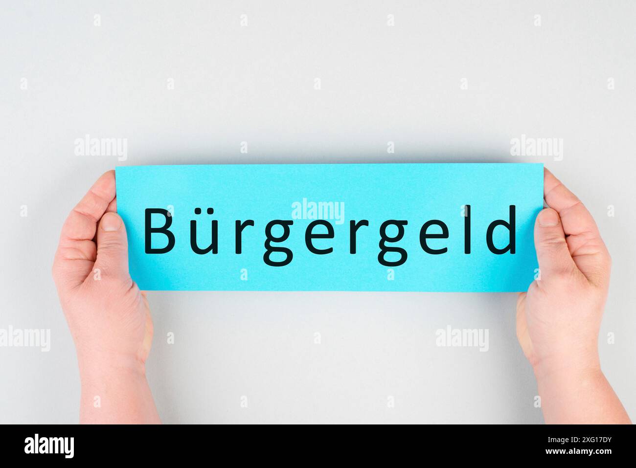 Le mot allemand pour l'argent des citoyens figure sur un papier, nouveau système d'aide financière pour le chômage en Allemagne, question sociale Banque D'Images