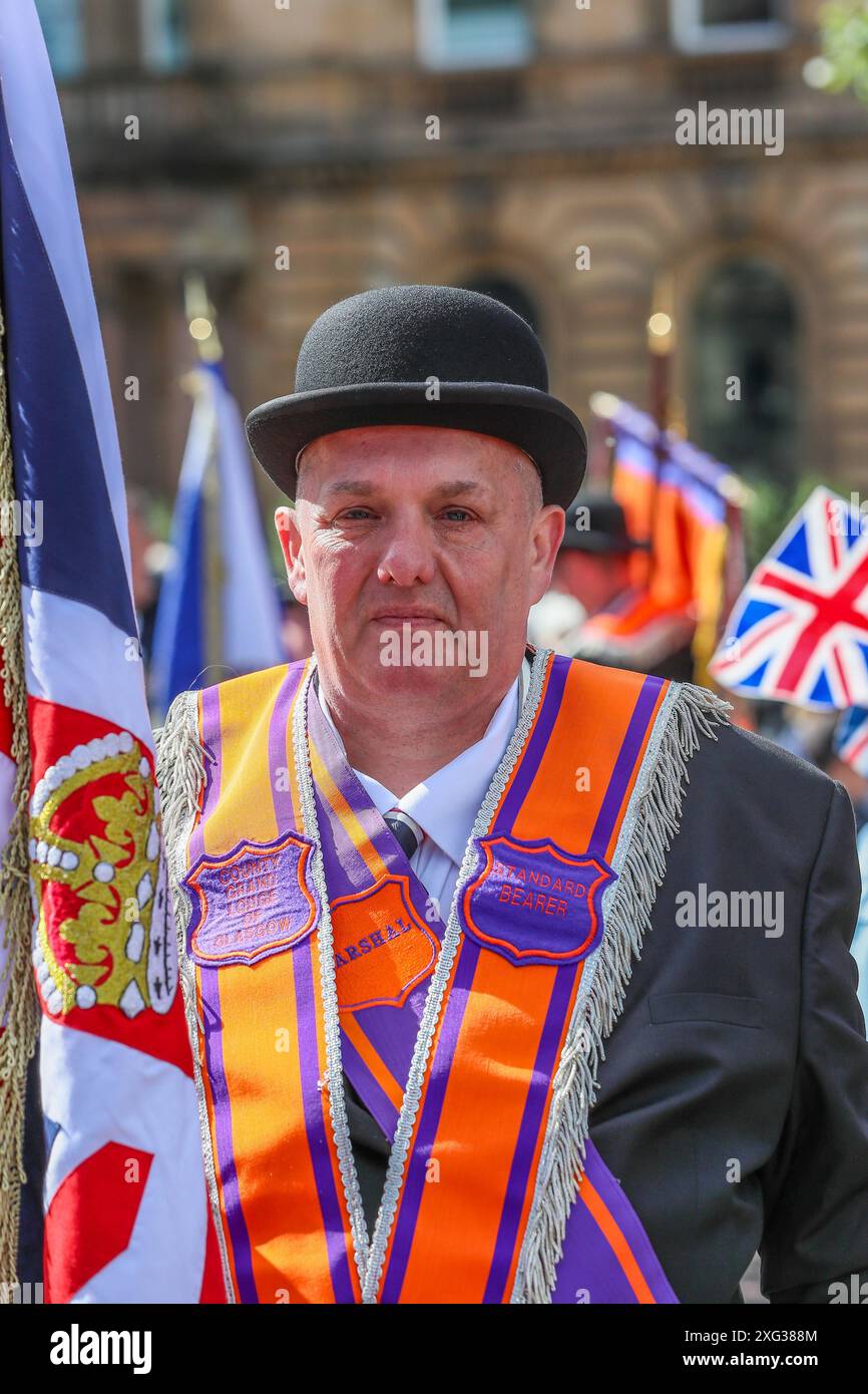 Glasgow, Royaume-Uni. 6 juillet 2024. La Grande Loge of Scotland Orange Order, ainsi que d'autres Orange Orders, ont organisé leur défilé annuel à Glasgow, en Écosse, pour célébrer le 12 juillet, avec environ 4000 participants. L’ordre Orange est la plus ancienne et la plus grande fraternité protestante d’Écosse avec ses racines remontant au XVIIIe siècle en Ulster. Crédit : Findlay/Alamy Live News Banque D'Images