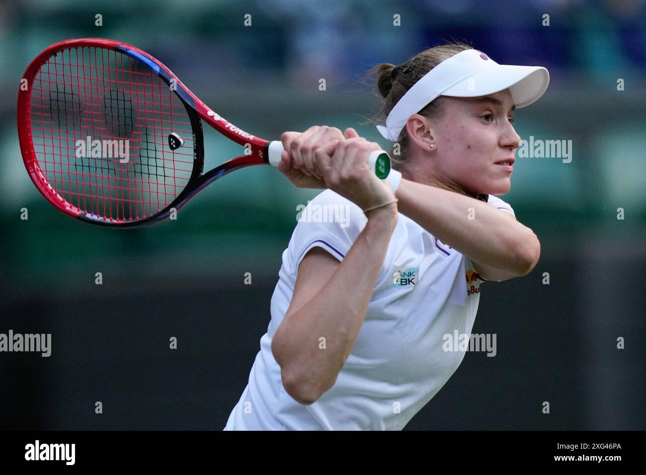 Elena Rybakina of Kazakhstan plays a backhand return to Caroline Wozniacki of Denmark during their third round match at the Wimbledon tennis championships in London, Saturday, July 6, 2024. (AP Photo/Alberto Pezzali) Banque D'Images