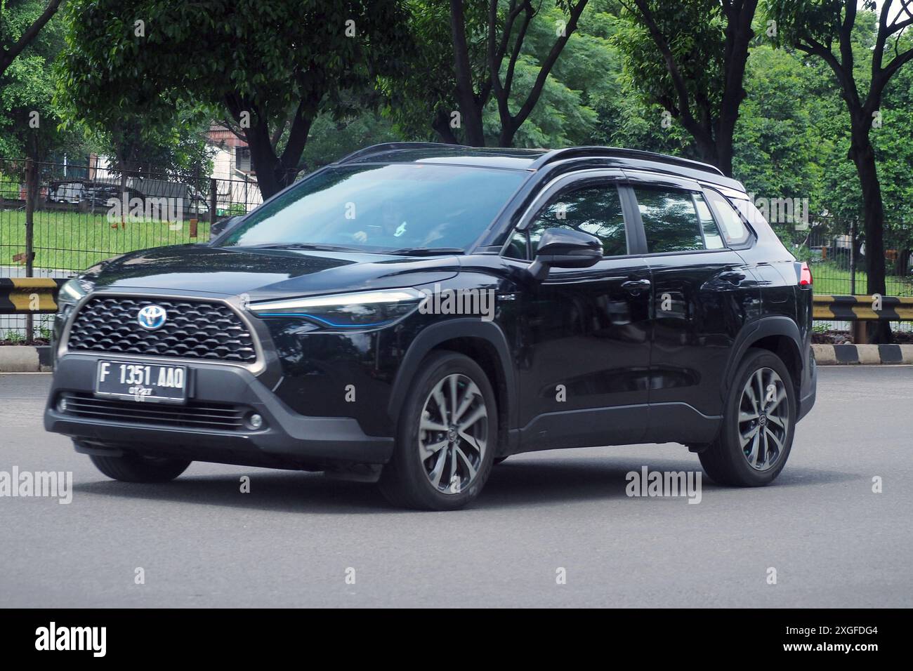 Blackr SUV Toyota Cross dans une route, aux affaires et commercial distric TB Simatupang Banque D'Images