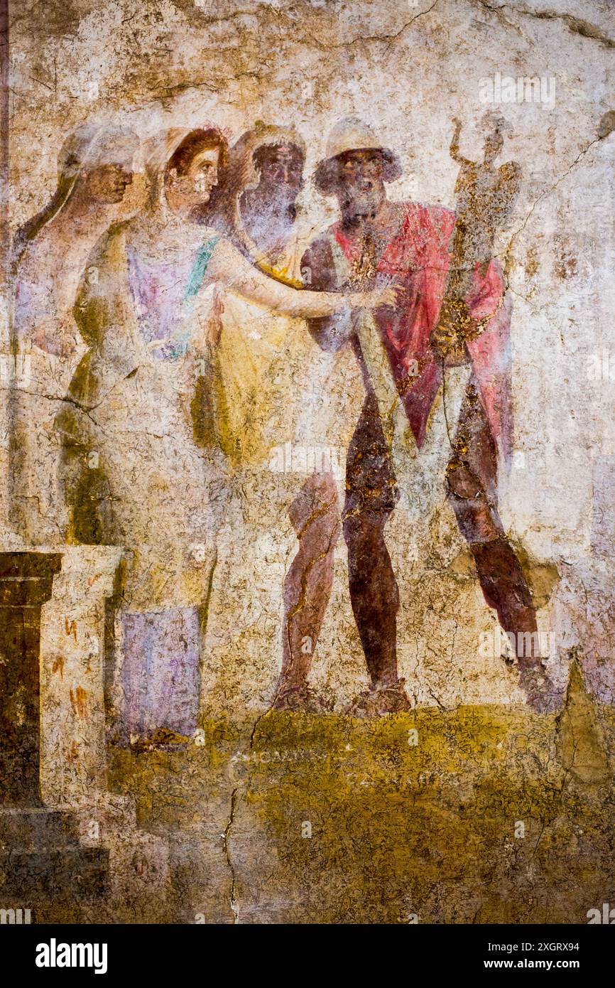 Odysseus (chapeau de pileus) emportant le palladion de Troie, avec l'aide de Diomède, contre la résistance de Cassandre et d'autres chevaux de Troie. Fresque antique de Pompéi. Banque D'Images