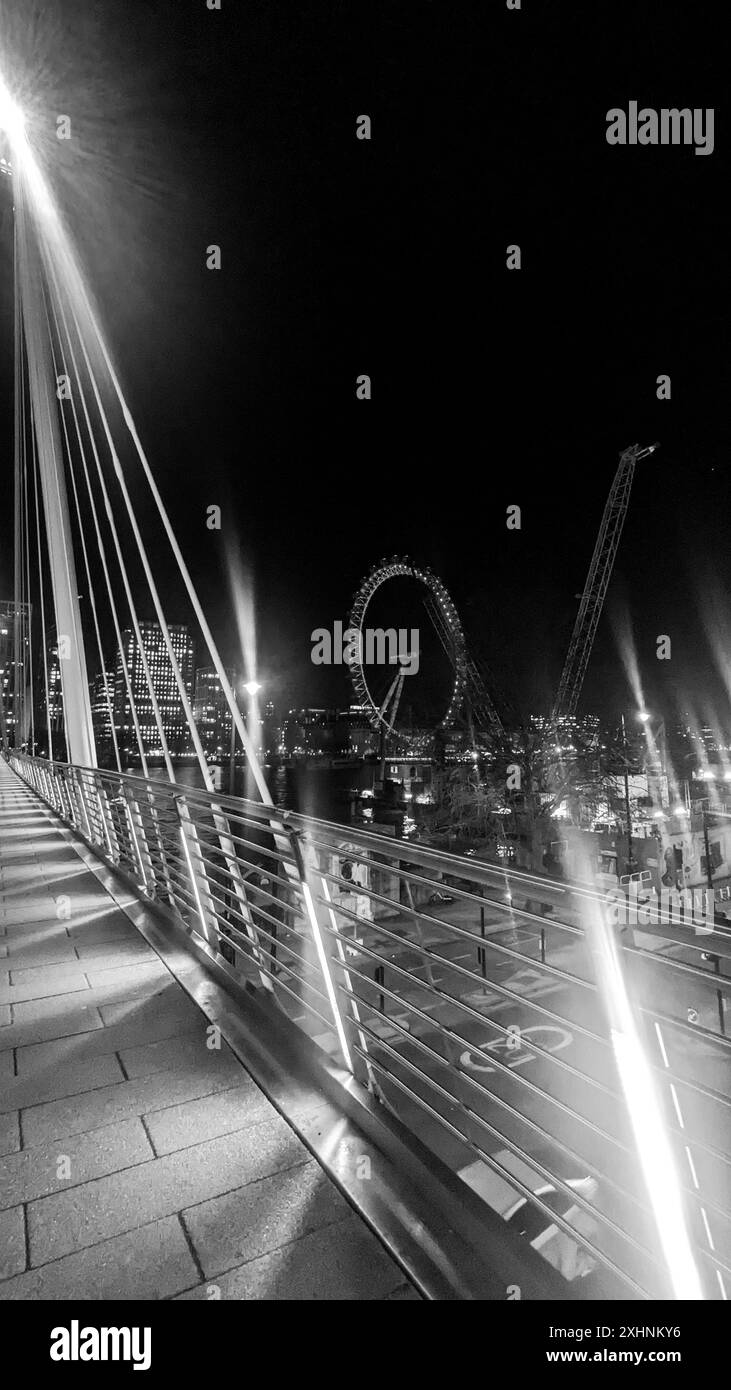 London Eye et Hungerford Bridge la nuit Banque D'Images