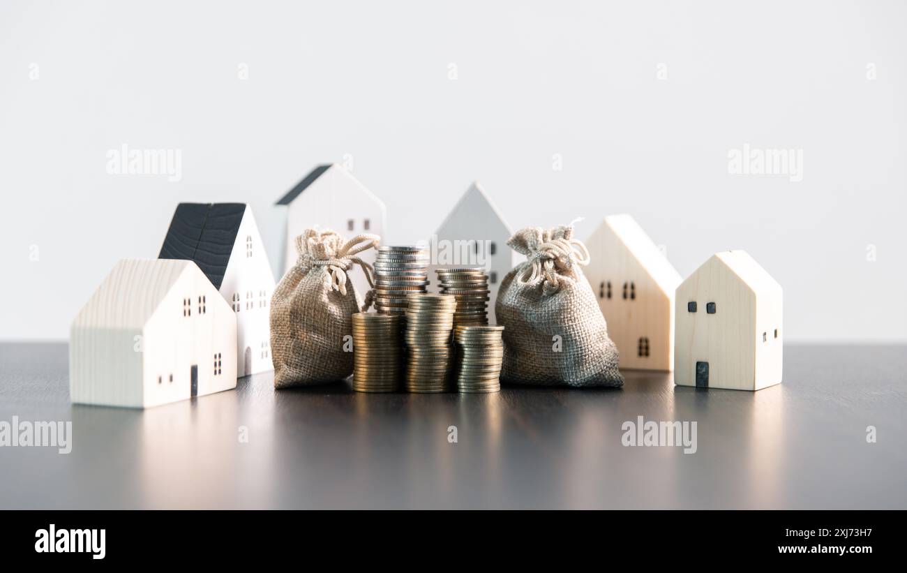 La fluctuation des prix des maisons sur le marché immobilier a un impact sur la valeur des propriétés, affectant les prêts et les coûts de location ainsi que les stratégies de financement immobilier pour prospectiv Banque D'Images