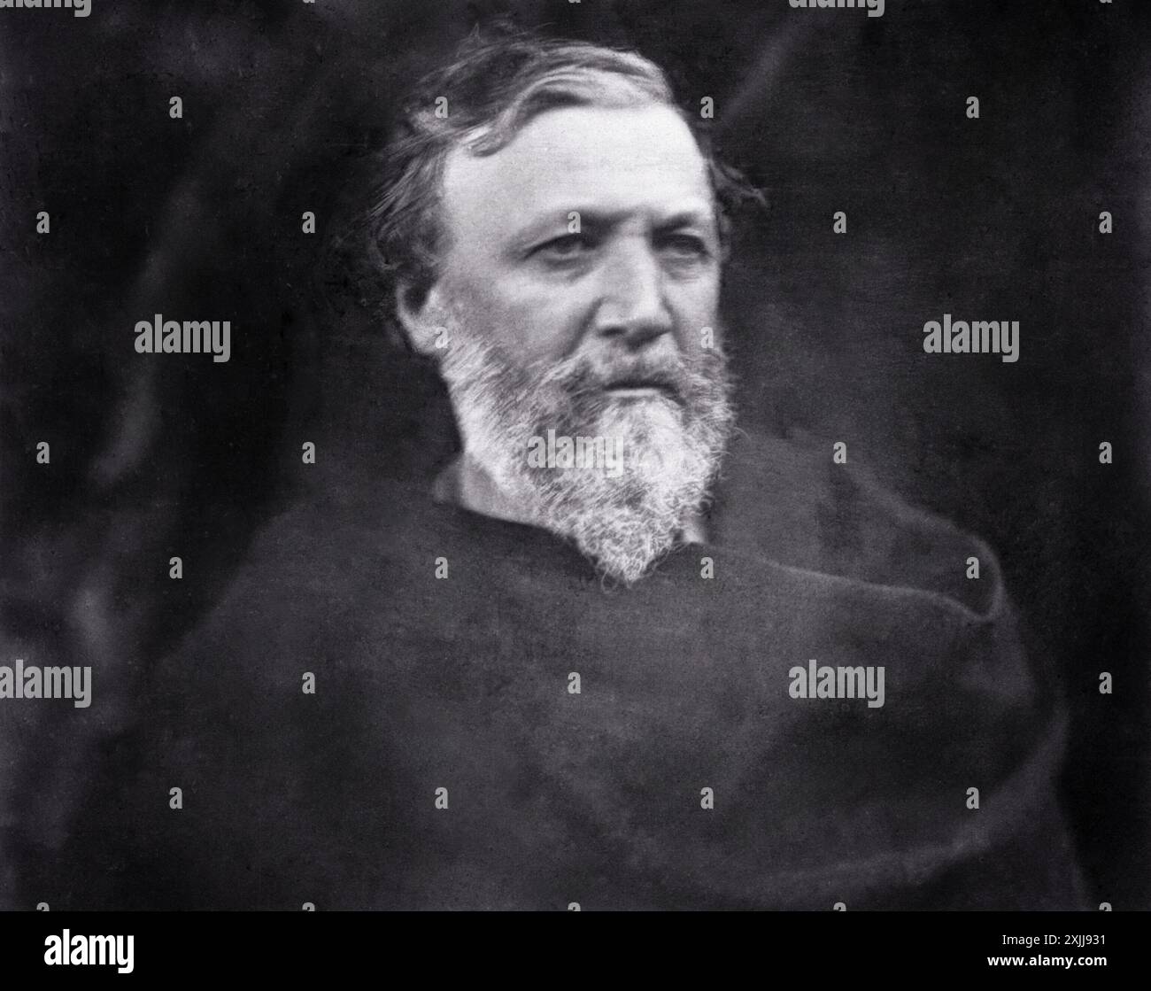 Robert Browning, un éminent poète anglais, est capturé dans ce portrait de Julia Margaret Cameron, pris en mai 1865. Browning est montré avec un regard contemplatif et une barbe complète, un spectacle commun pour l'époque victorienne. Banque D'Images