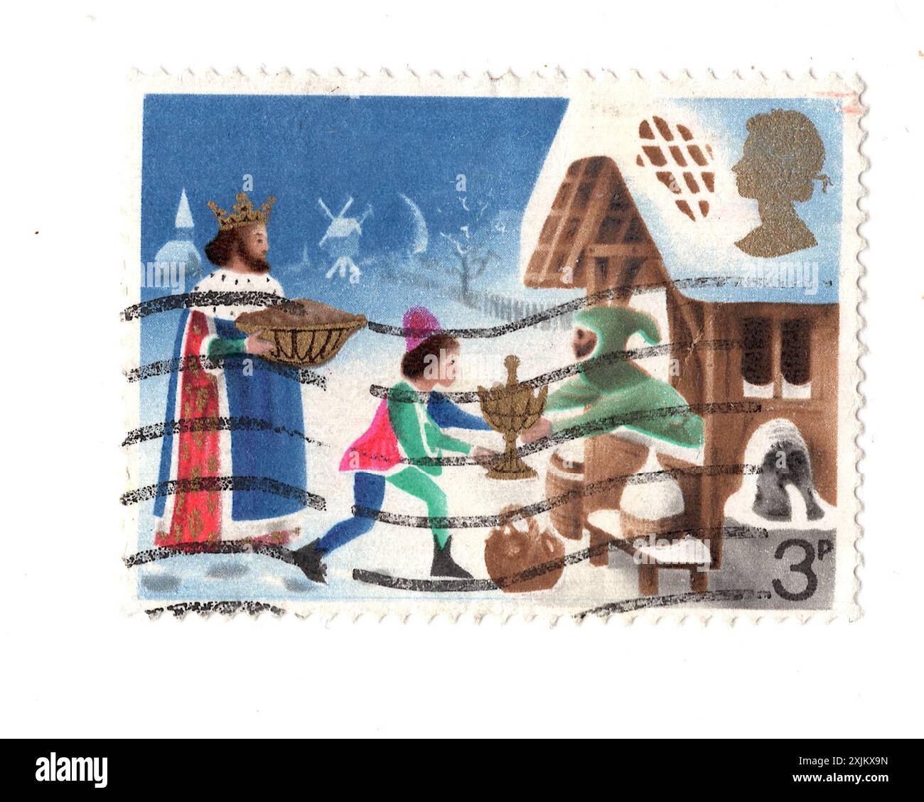 Un timbre vintage de Noël du Royaume-Uni sur fond blanc. Banque D'Images