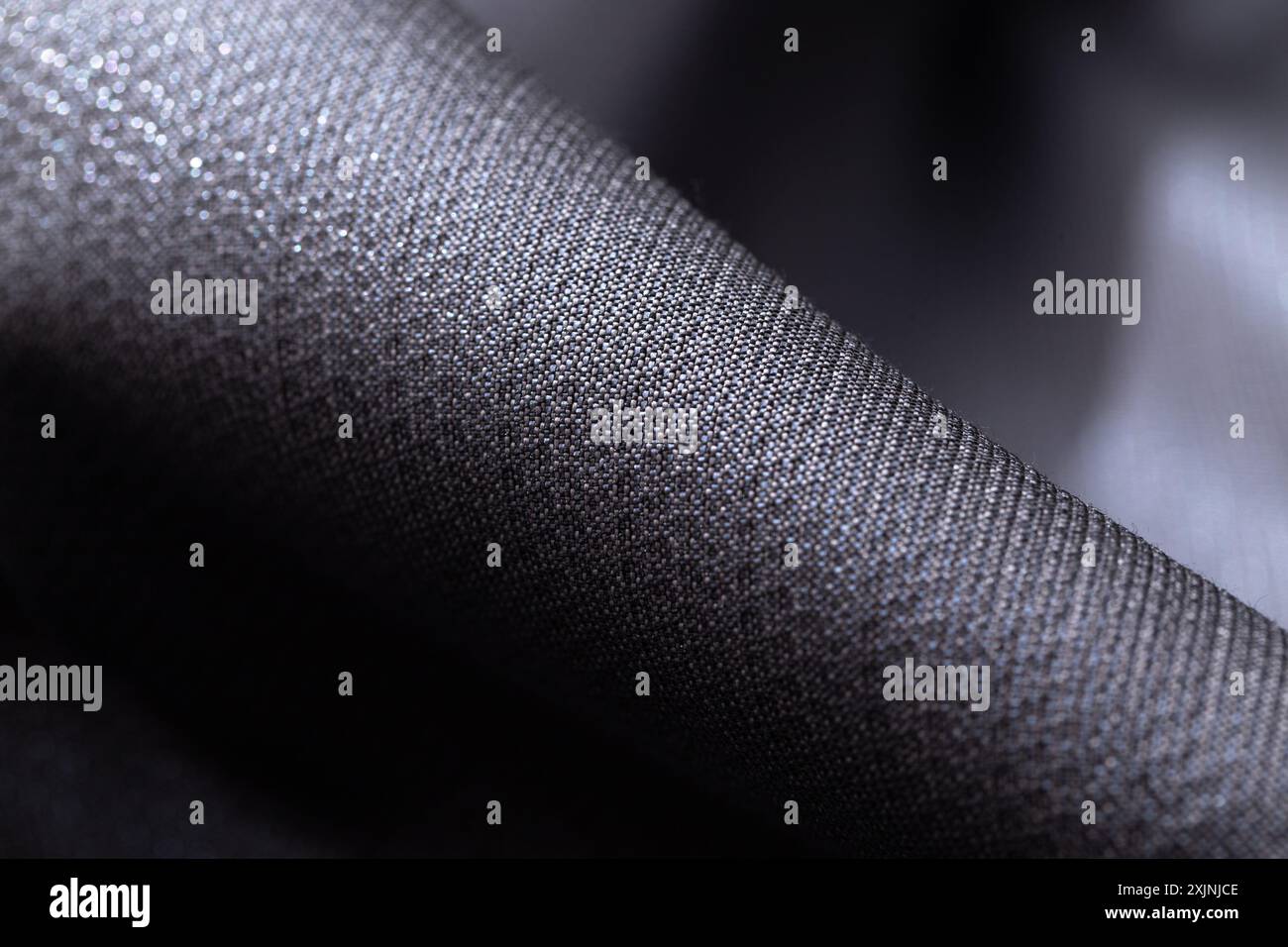 Gros plan d'un tissu gris foncé texturé. Banque D'Images