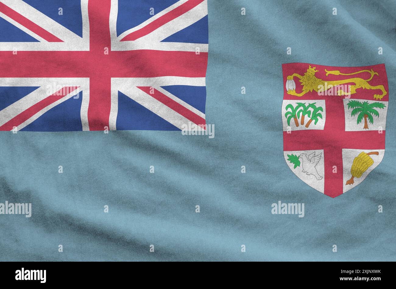 Drapeau fidjien représenté sur un tissu ondulé plié de vieux tissus en gros plan Banque D'Images