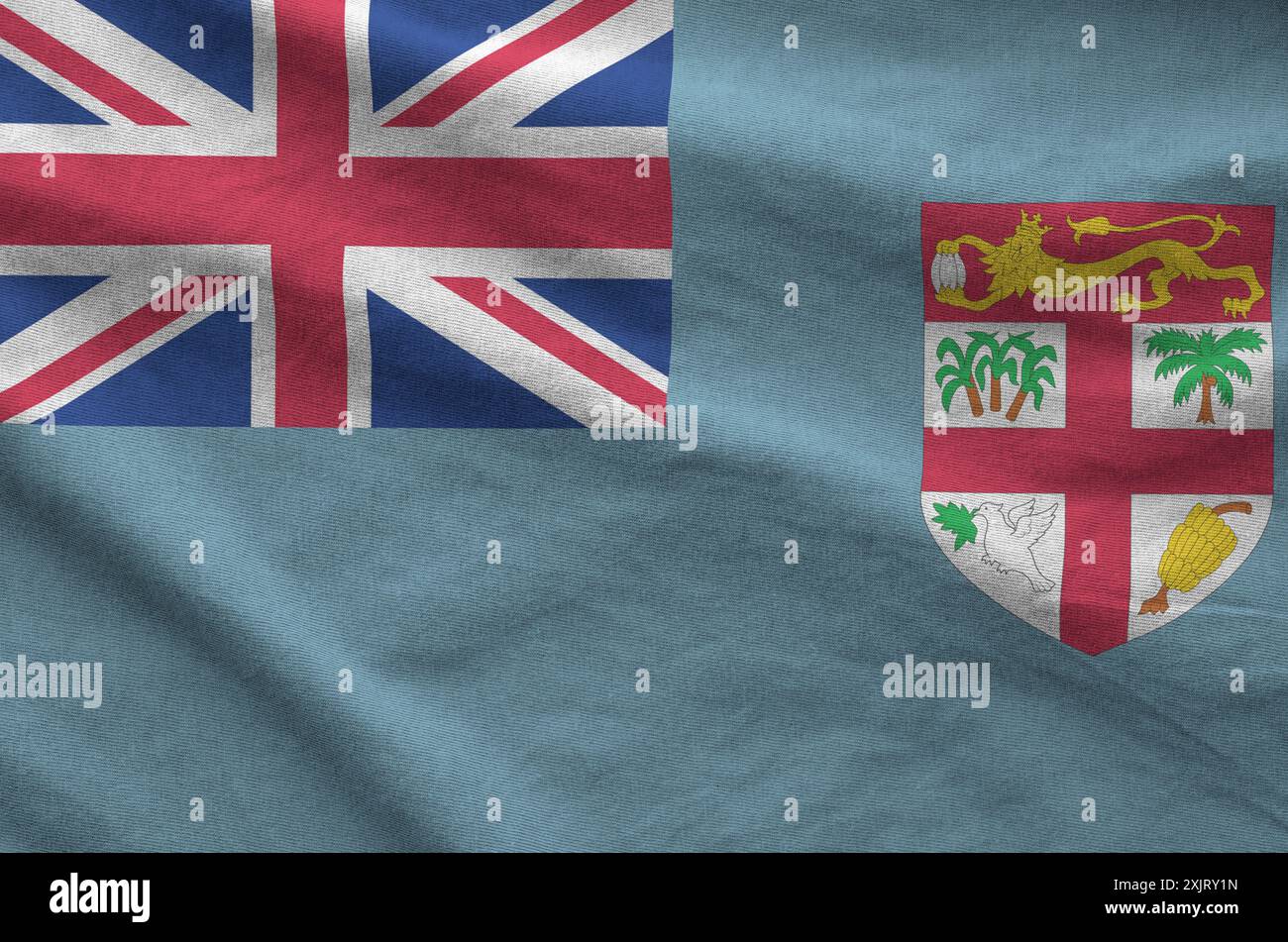 Drapeau fidjien représenté sur un tissu ondulé plié de vieux tissus en gros plan Banque D'Images