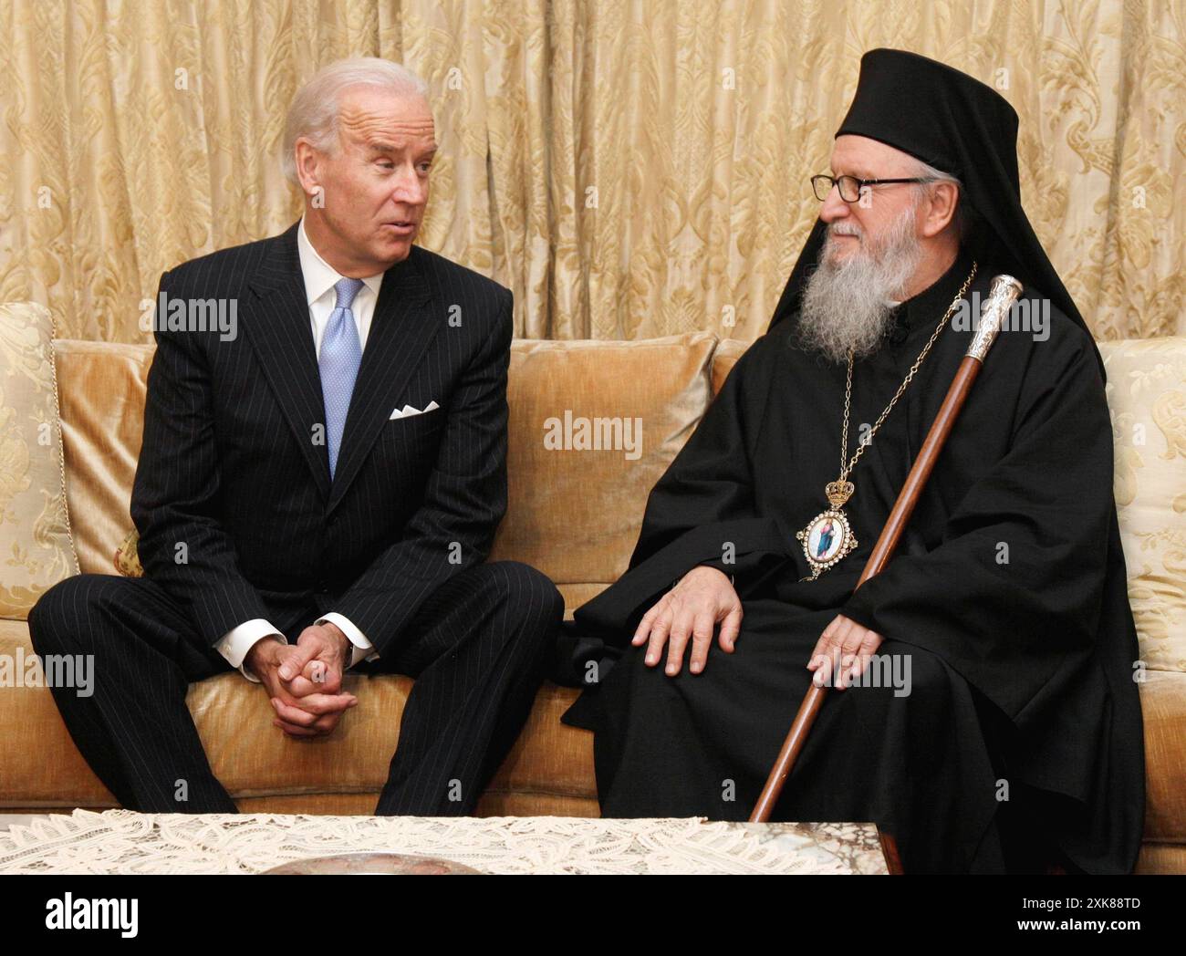 FILE - Vice President Joe Biden poses for photos with Archbishop Demetrios, the Primate of the Greek Orthodox Church in America, at the beginning of their meeting, in New York, Nov. 16, 2011. Historians and political advisers say history will be kinder to President Joe Biden than voters have been. Biden dropped out of the presidential race Sunday, July 21, 2024, clearing the way for a new Democratic nominee. (AP Photo/Richard Drew, File) Banque D'Images