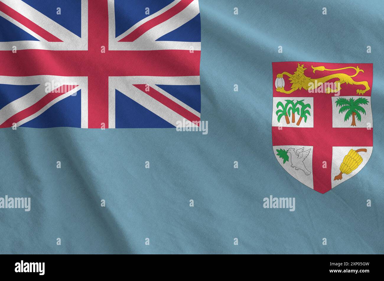 Drapeau fidjien représenté sur un tissu ondulé plié de vieux tissus en gros plan Banque D'Images