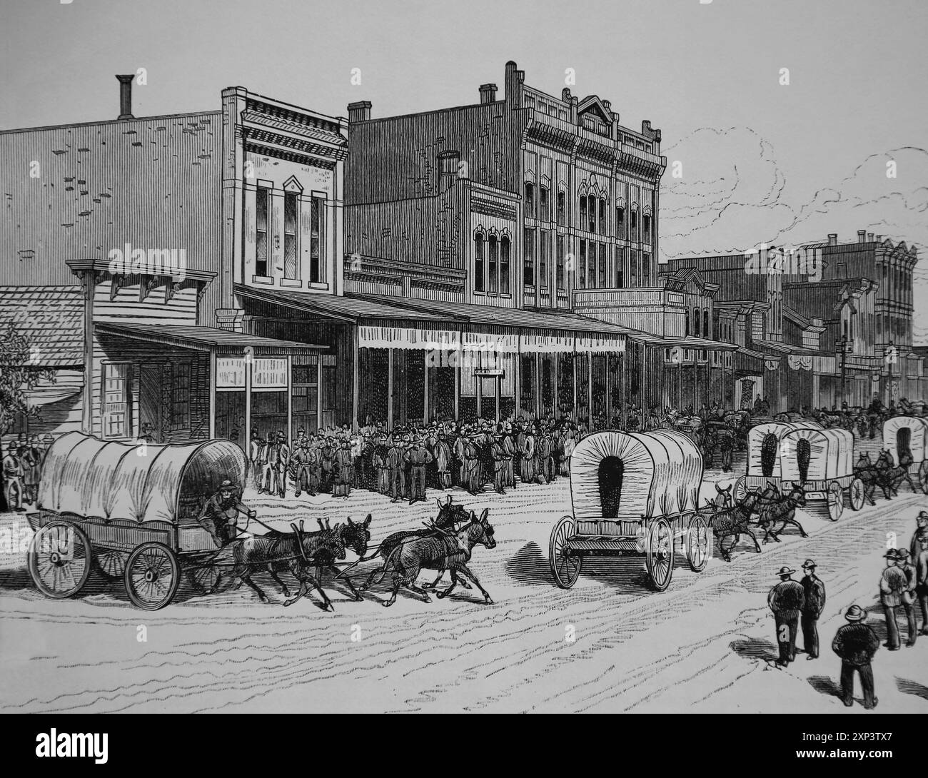 ÉTATS-UNIS. Un train de wagons de colons qui espéraient revendiquer des terres en Oklahoma quittant Arkansas City, Kansas. Gravure. Journal illustré de Frank Leslie, Banque D'Images