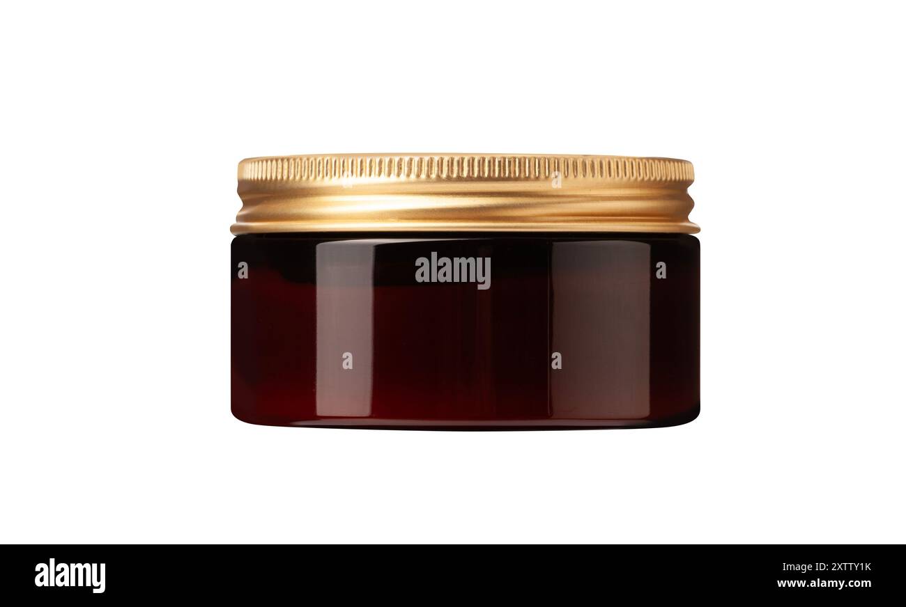 pot en verre de produit de toilettage pour coiffer les cheveux couvercle doré reposant sur le côté, isolé sur fond blanc. Avec masque Banque D'Images