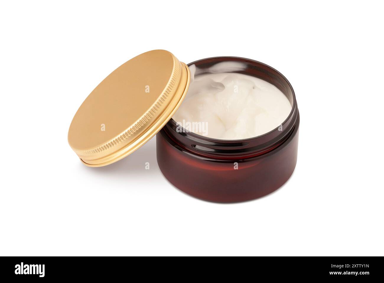 pot en verre de produit de toilettage pour coiffer les cheveux couvercle doré reposant sur le côté, isolé sur fond blanc. Avec masque Banque D'Images